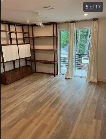 Spare room with wood finished floors, baseboards,