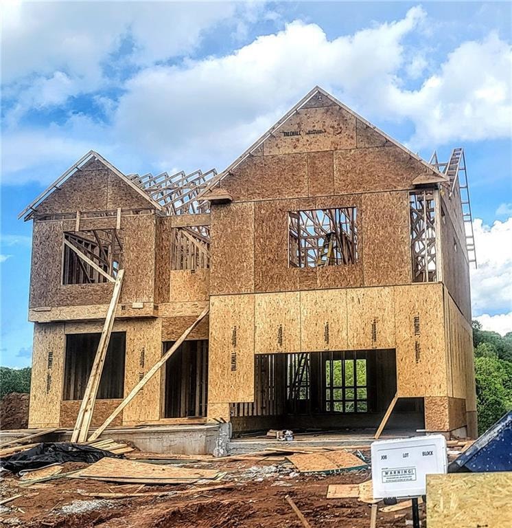 Unfinished property with roof with shingles