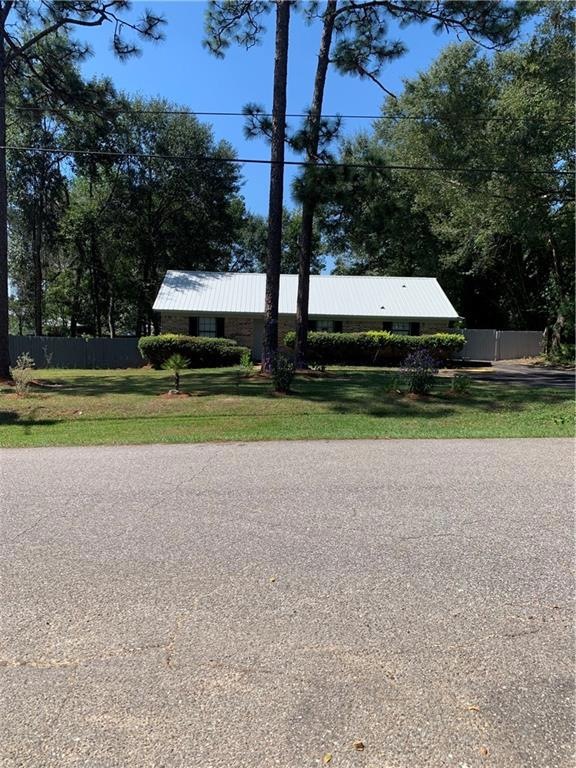 Front with manicured lawn