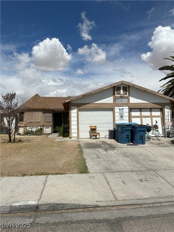 View of front of home featuring concrete driveway