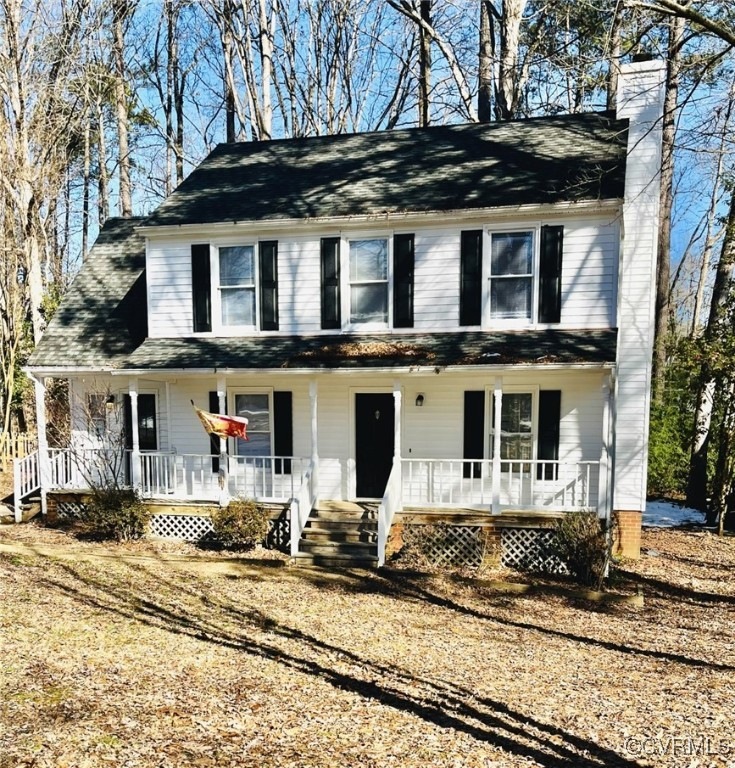 Farmhouse featuring a porch