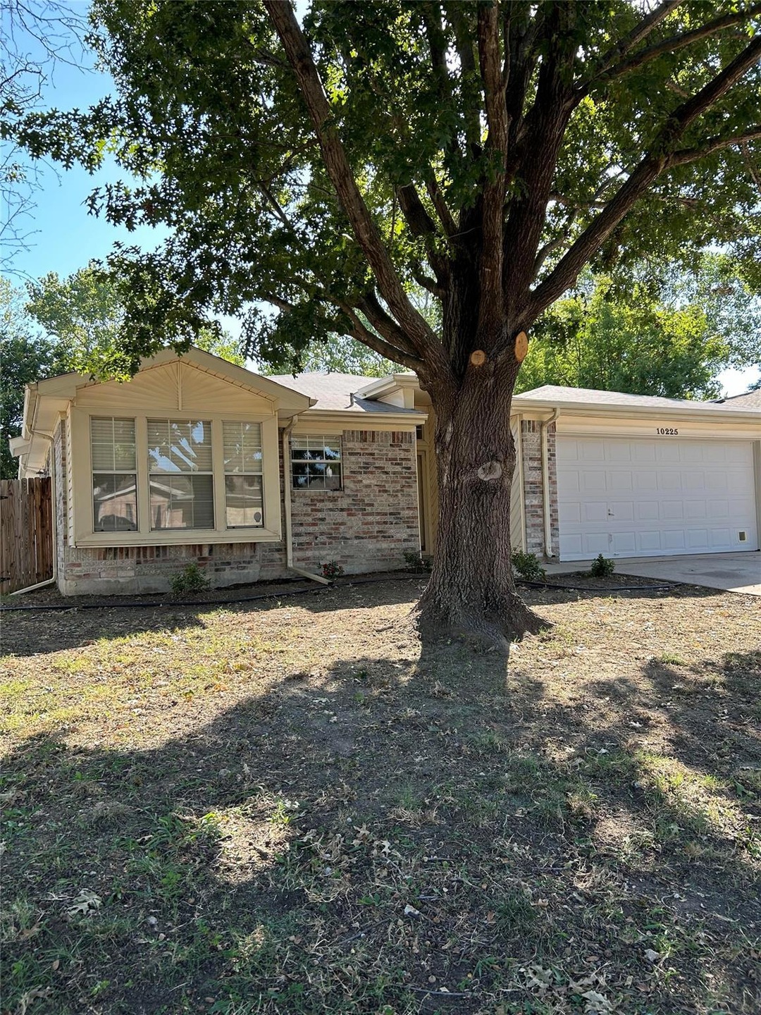 Single story home featuring a garage