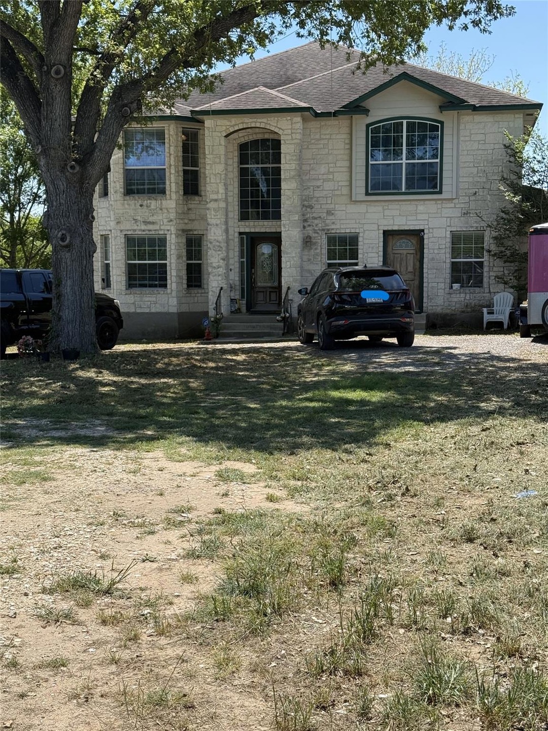 View of front of property with roof with shingles