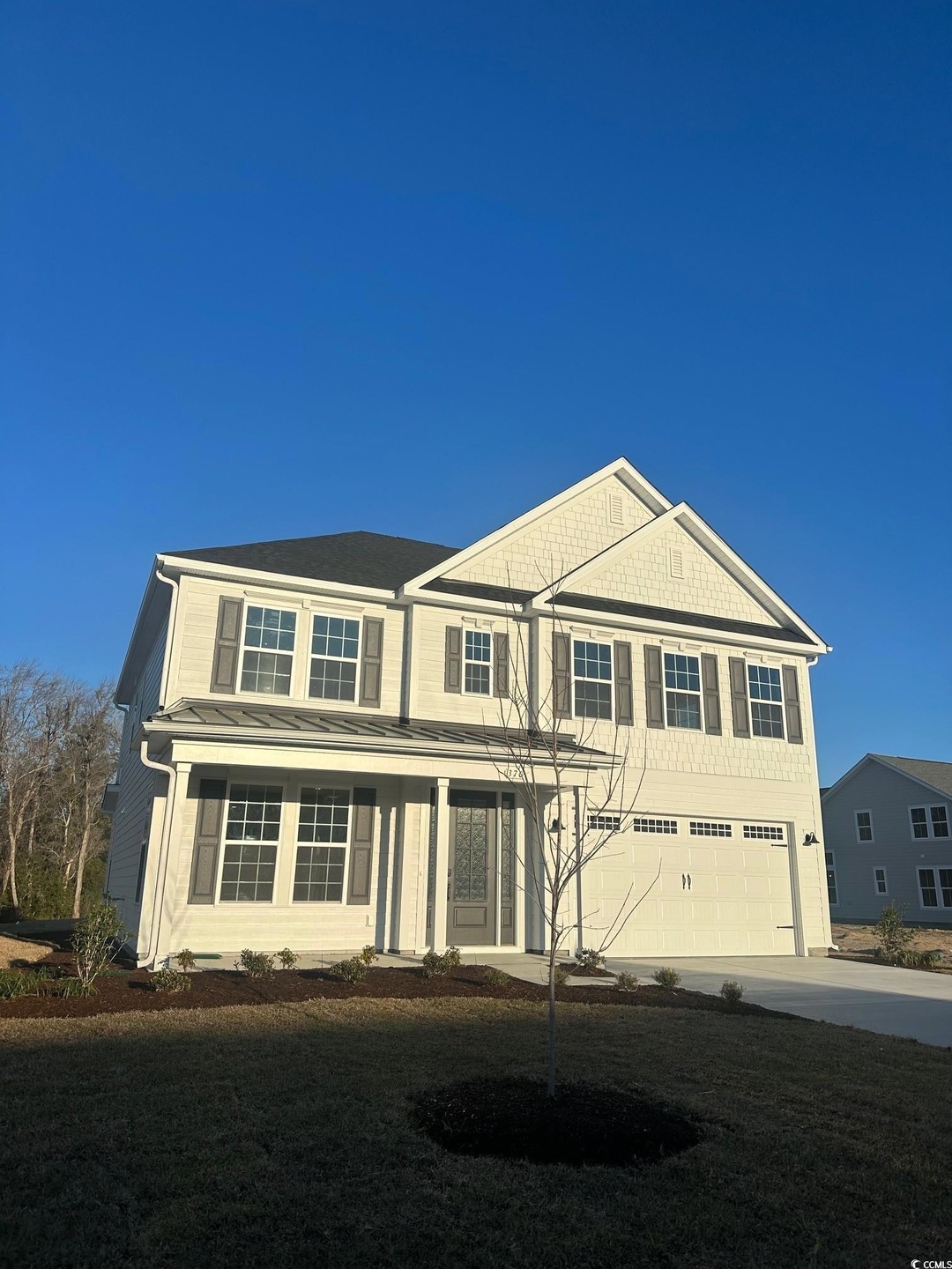 View of front of house with an attached garage and