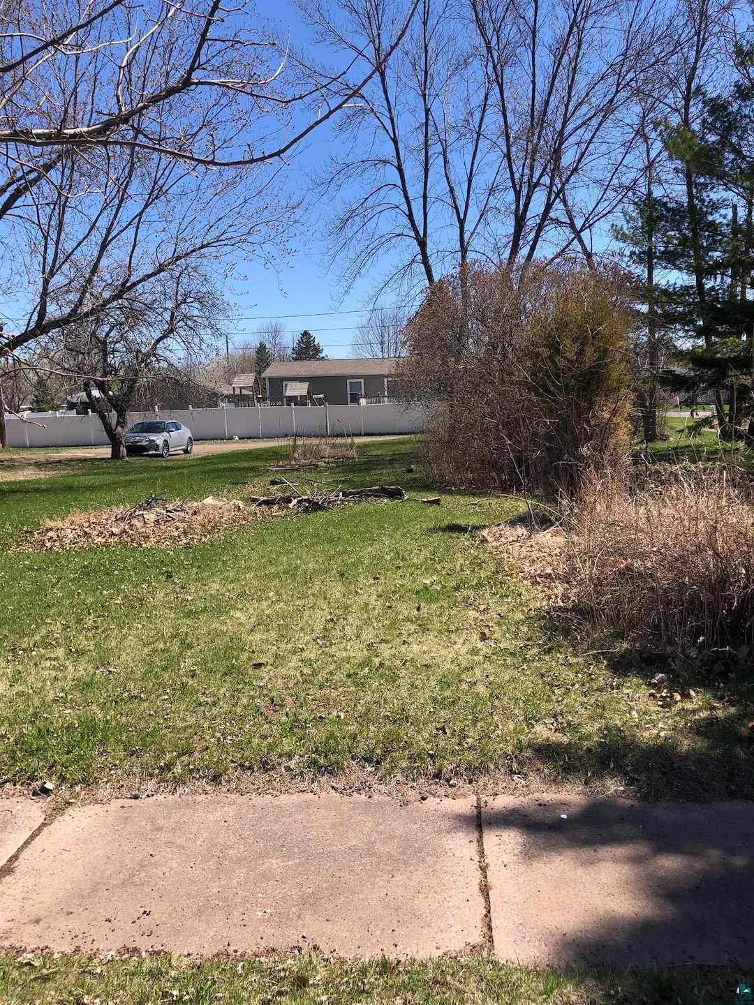 View of yard featuring fence