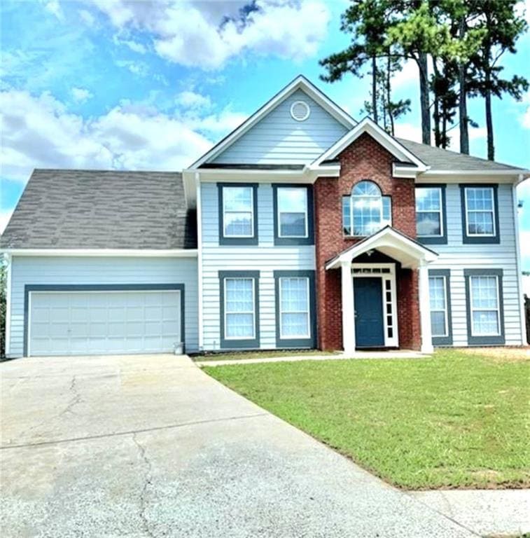 View of front of property featuring a front lawn