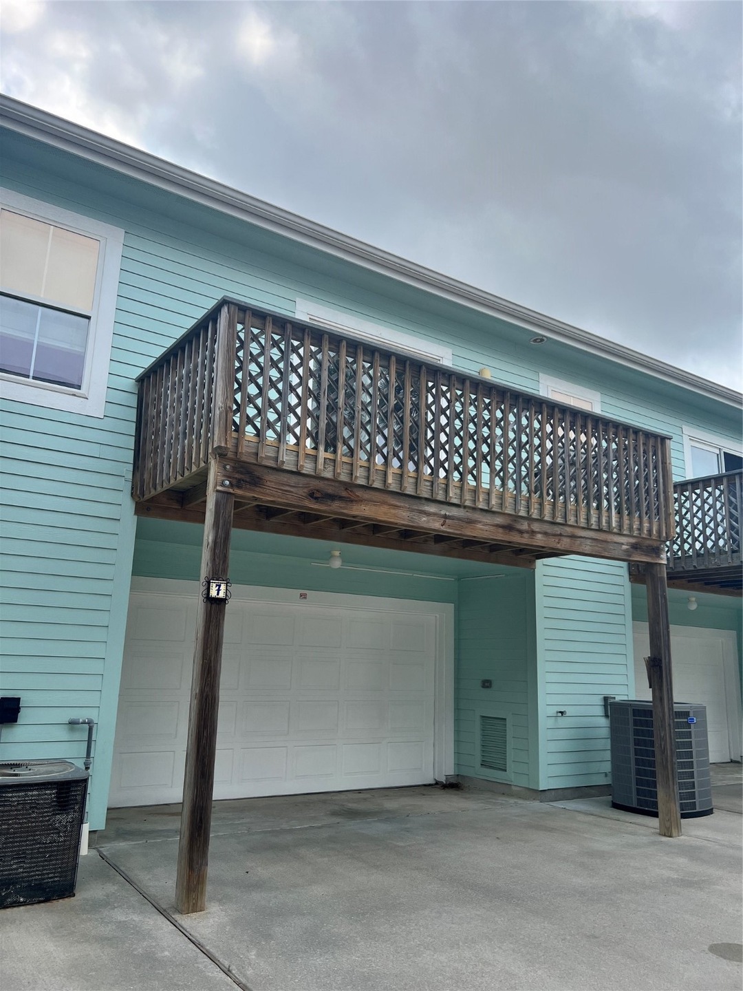 This is a two-story, light blue home featuring an