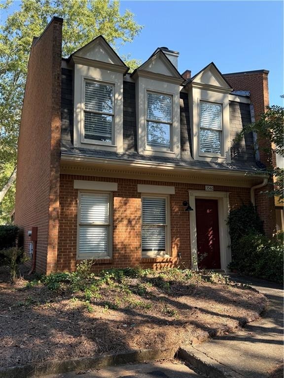View of front facade with brick siding