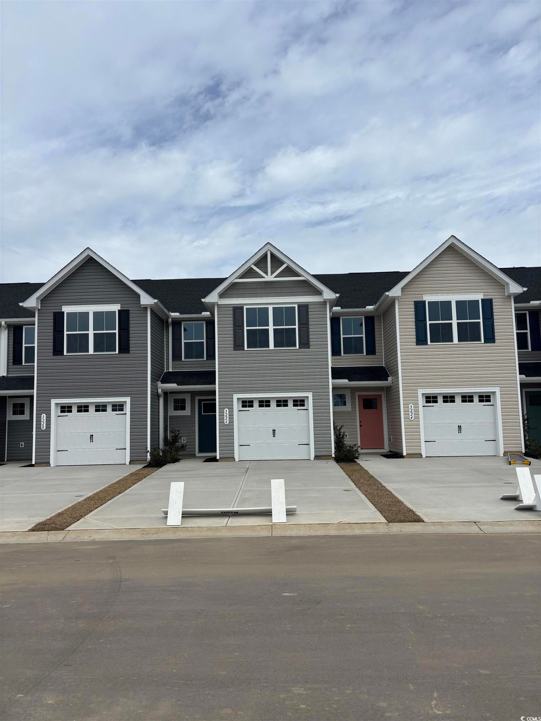 Multi unit property featuring driveway and a garag