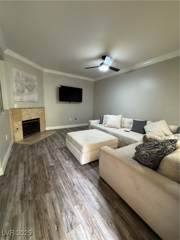 Living room with baseboards, ornamental molding, a