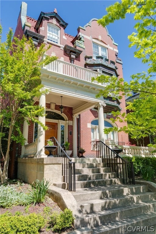 2702 Monument Avenue with classical columned porch and gabled roof.