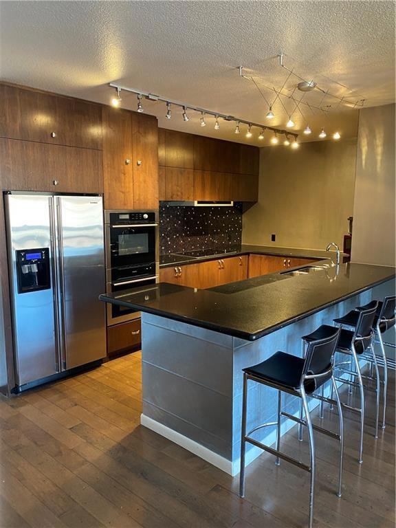 Kitchen with stainless steel fridge with ice disp