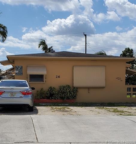 Front view of property with address.