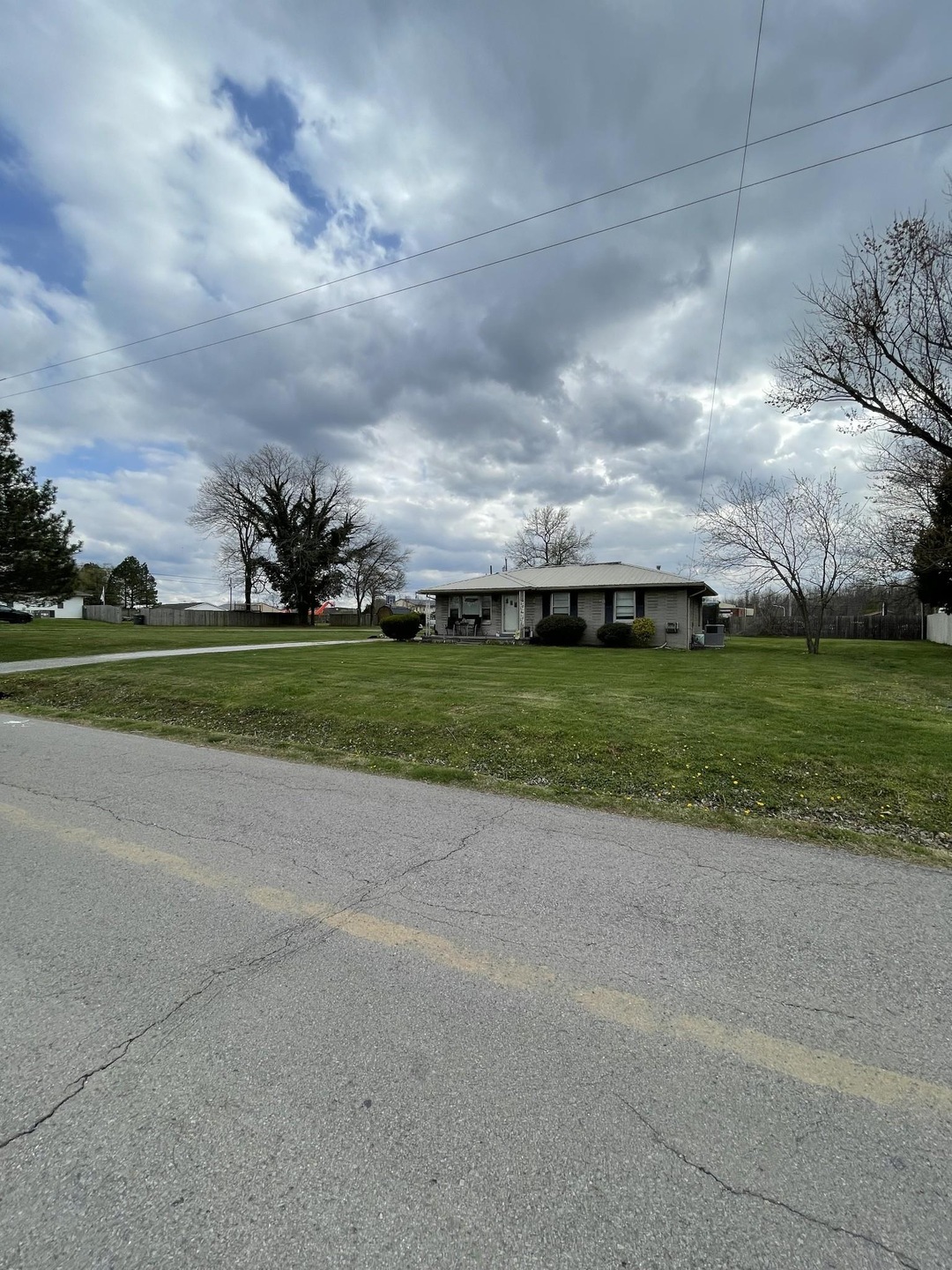 Front view of Fully brick home with a metal roof