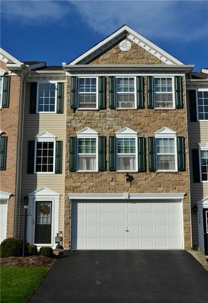 Welcome to this stone front luxury townhome at 114
