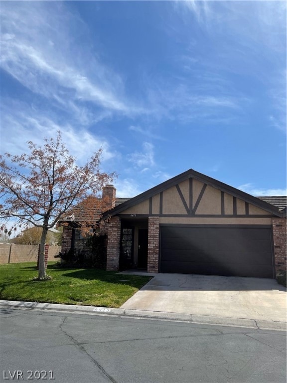 Front of Townhome with a yard of grass! The HOA ta