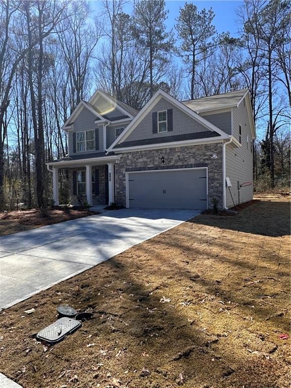 View of front facade featuring stone siding, concr