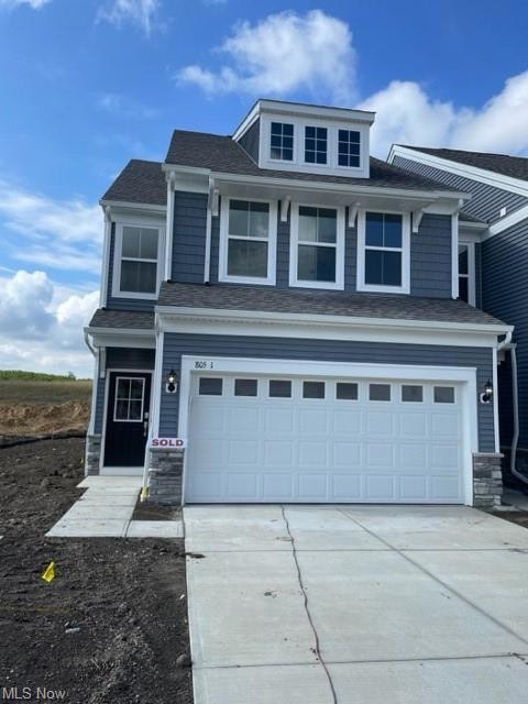 View of front of home featuring a garage