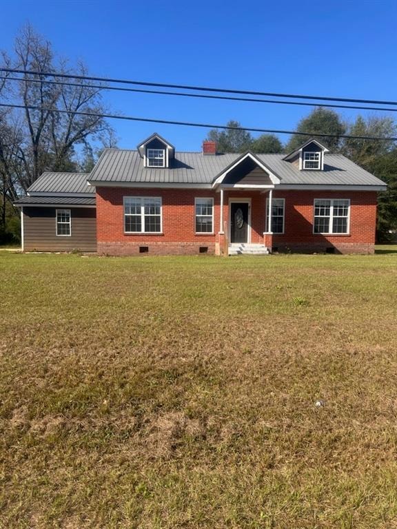 Ranch-style house with a front lawn