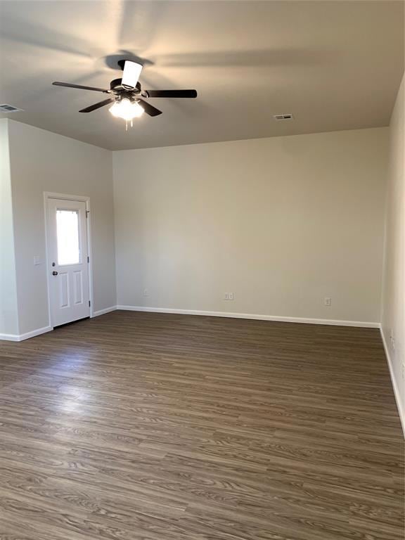 Unfurnished room with ceiling fan, baseboards, and
