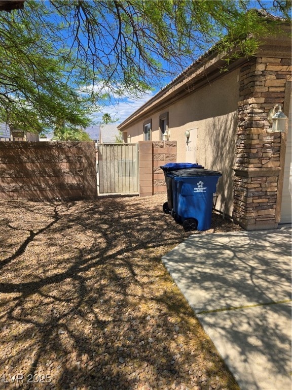 Driveway side showing entrance to back yard.