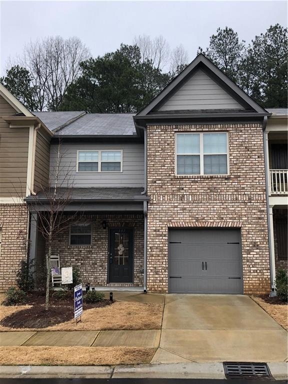 Beautiful brick with rocking chair front porch