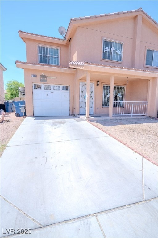 View of front of home featuring stucco siding, an