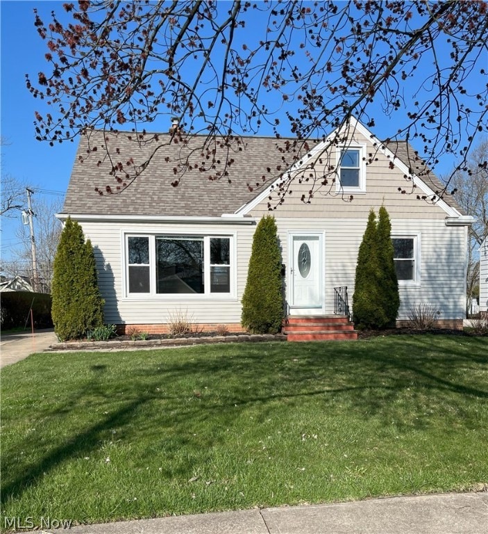 View of front of house with a front yard