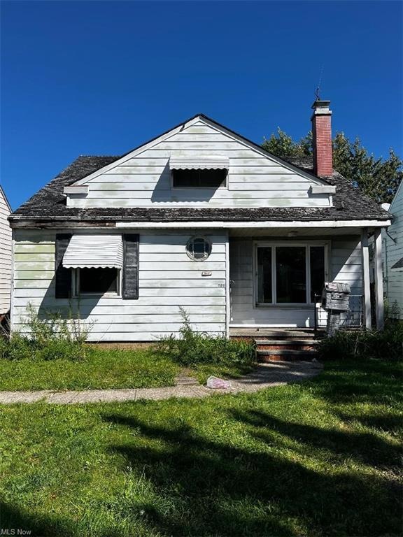 Back of property with a yard