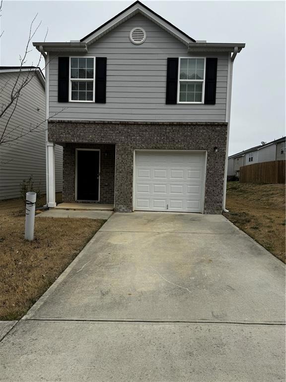 Front of property with a garage