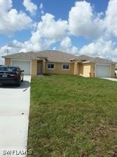 Single story home featuring an attached garage, dr