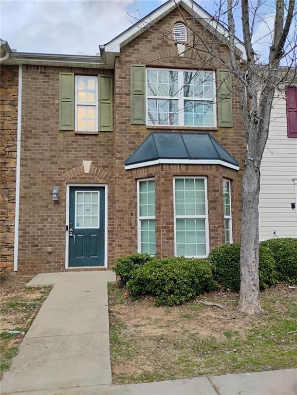 View of front of house with brick siding