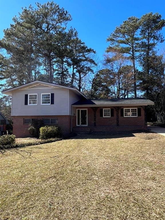 Split level home with a front yard