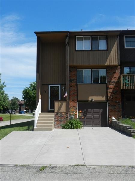 End unit with extra wide driveway. Eliminates any 
