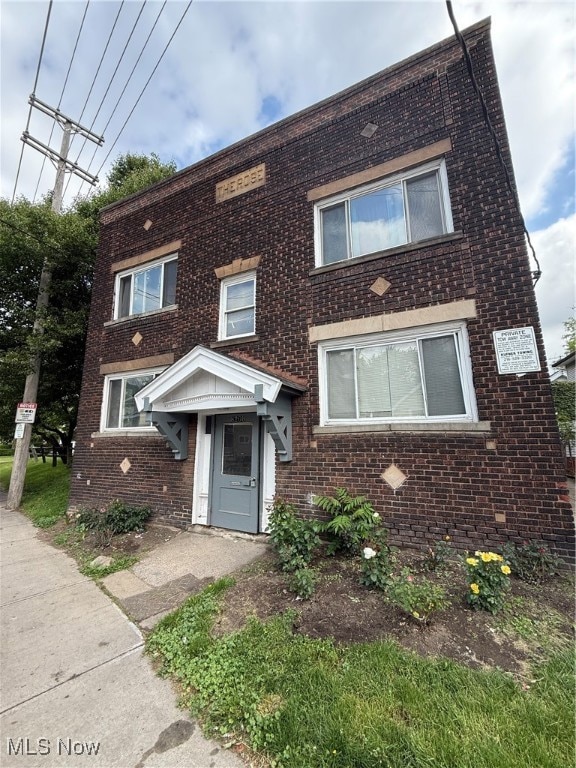 View of front of property with brick siding