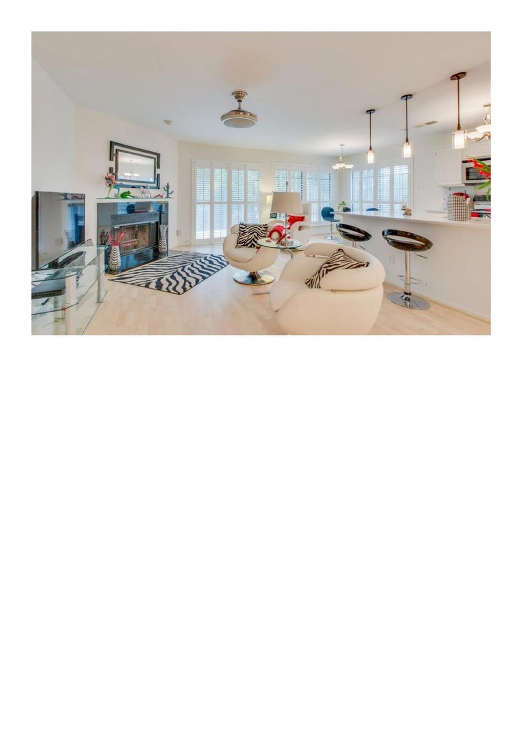 Living room with hardwood / wood-style floors and a wealth of natural light
