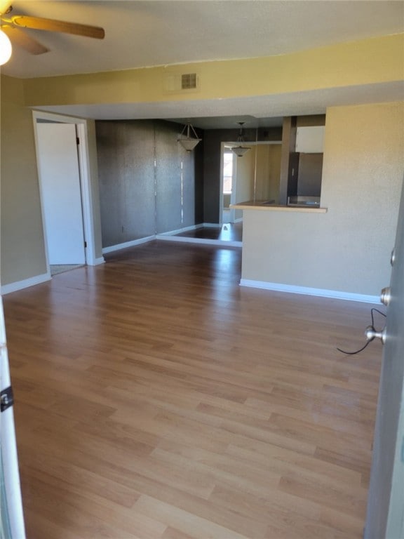 Spare room featuring light wood-style floors and c