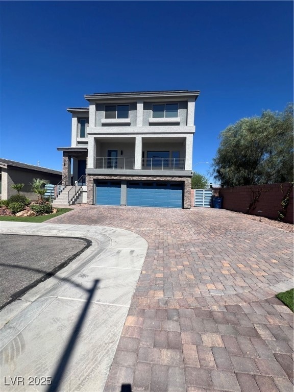 View of front of property featuring an attached ga