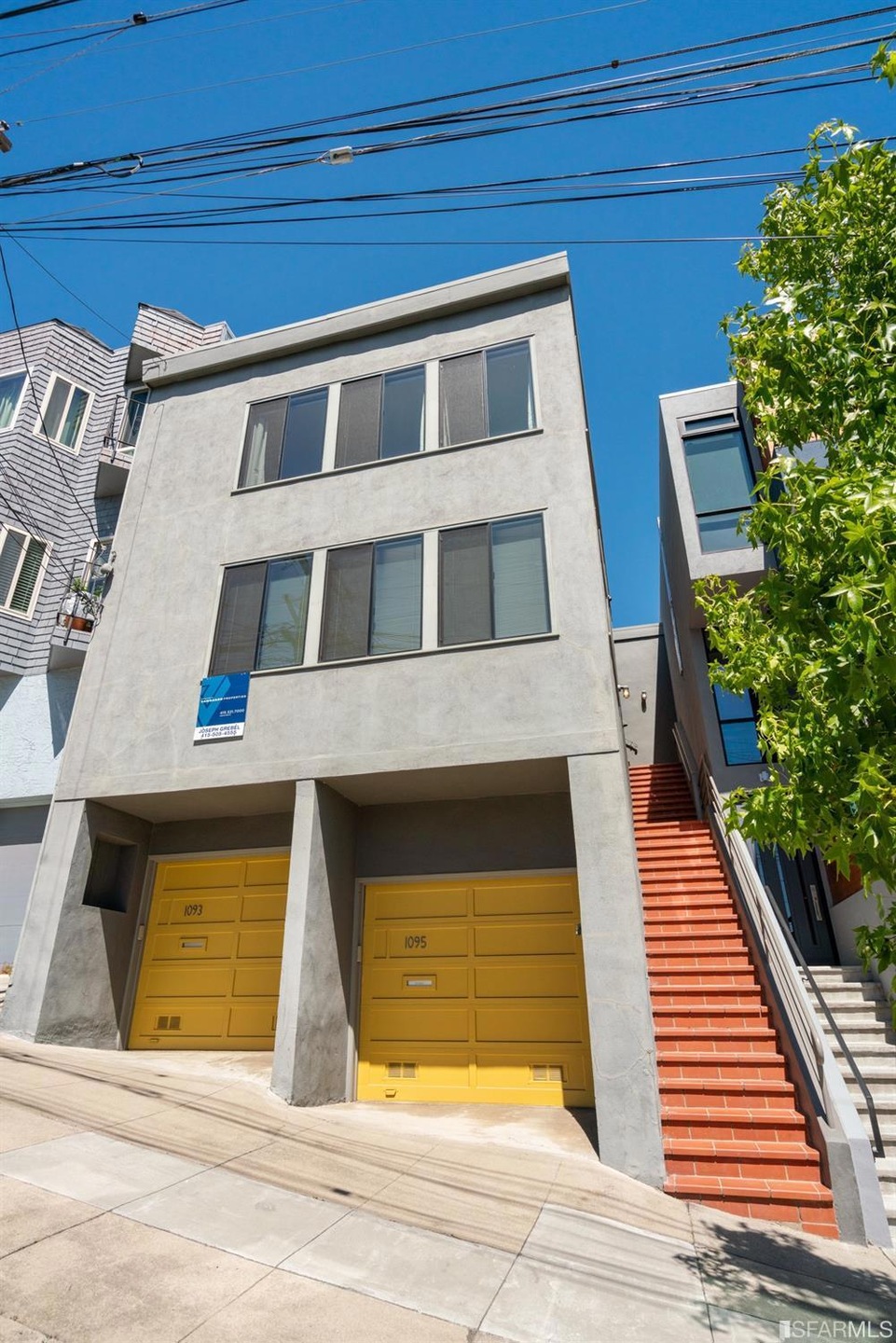Front Facade. Big Windows Front and Side of Buildi