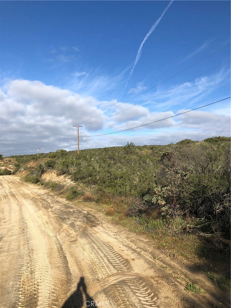 Paseo Van Scoyk Road in front of parcel.