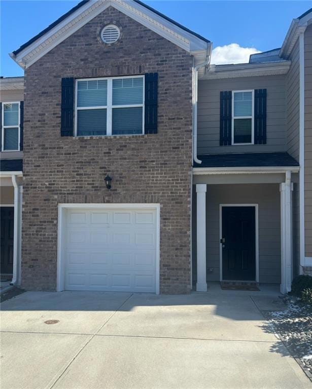 View of front of property featuring an attached ga