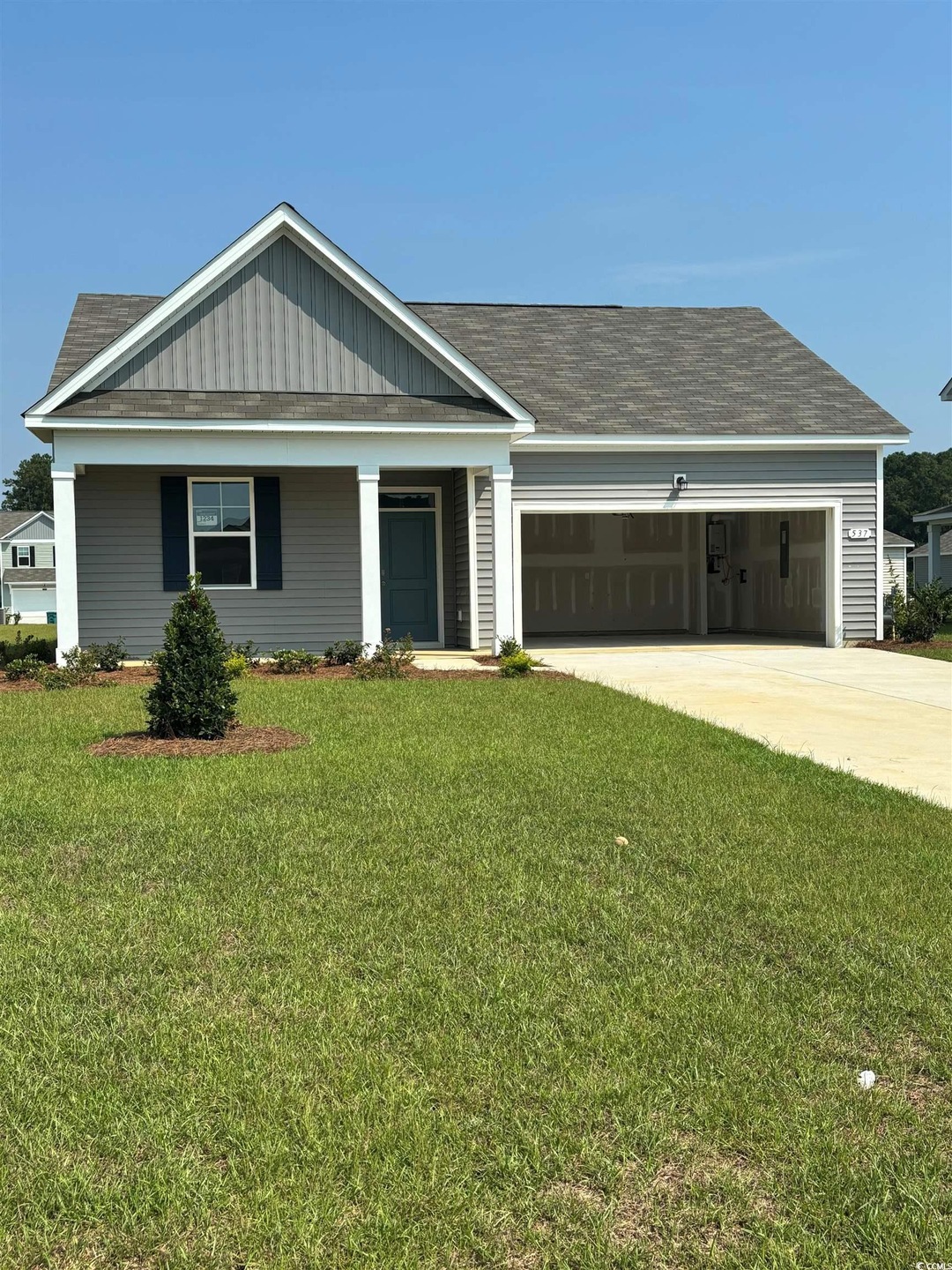 Craftsman-style house featuring a garage and a fro