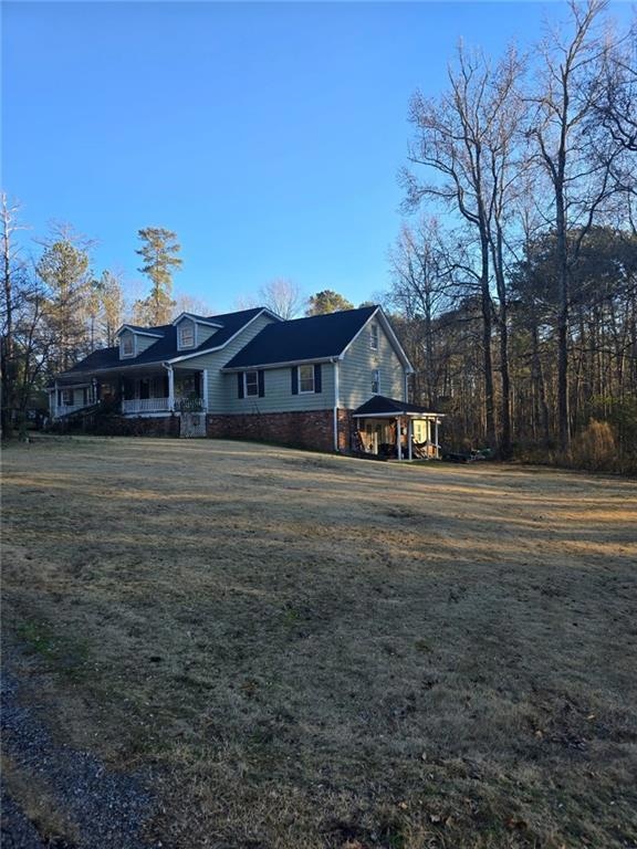 Ranch-style home with a gazebo and a front yard