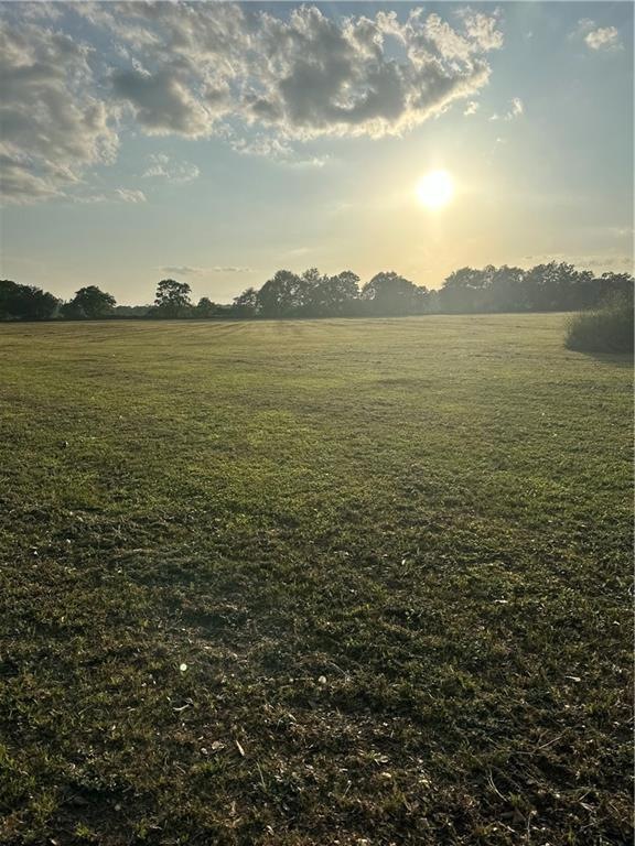Nature at dusk featuring a rural view