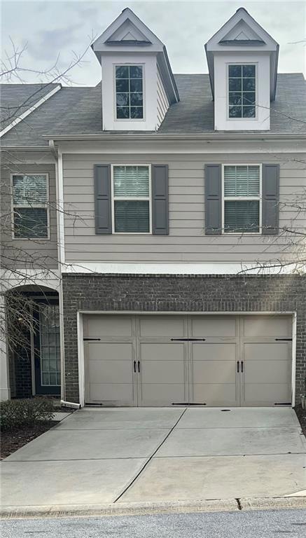 View of front of property featuring a garage