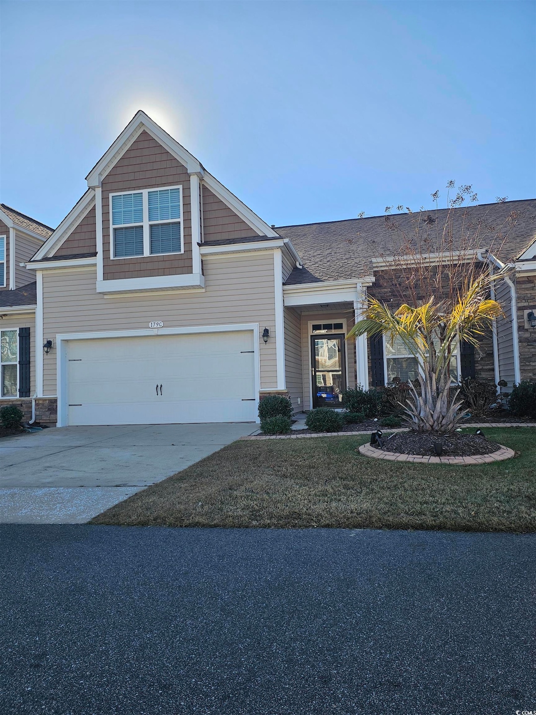 View of front of property with a garage