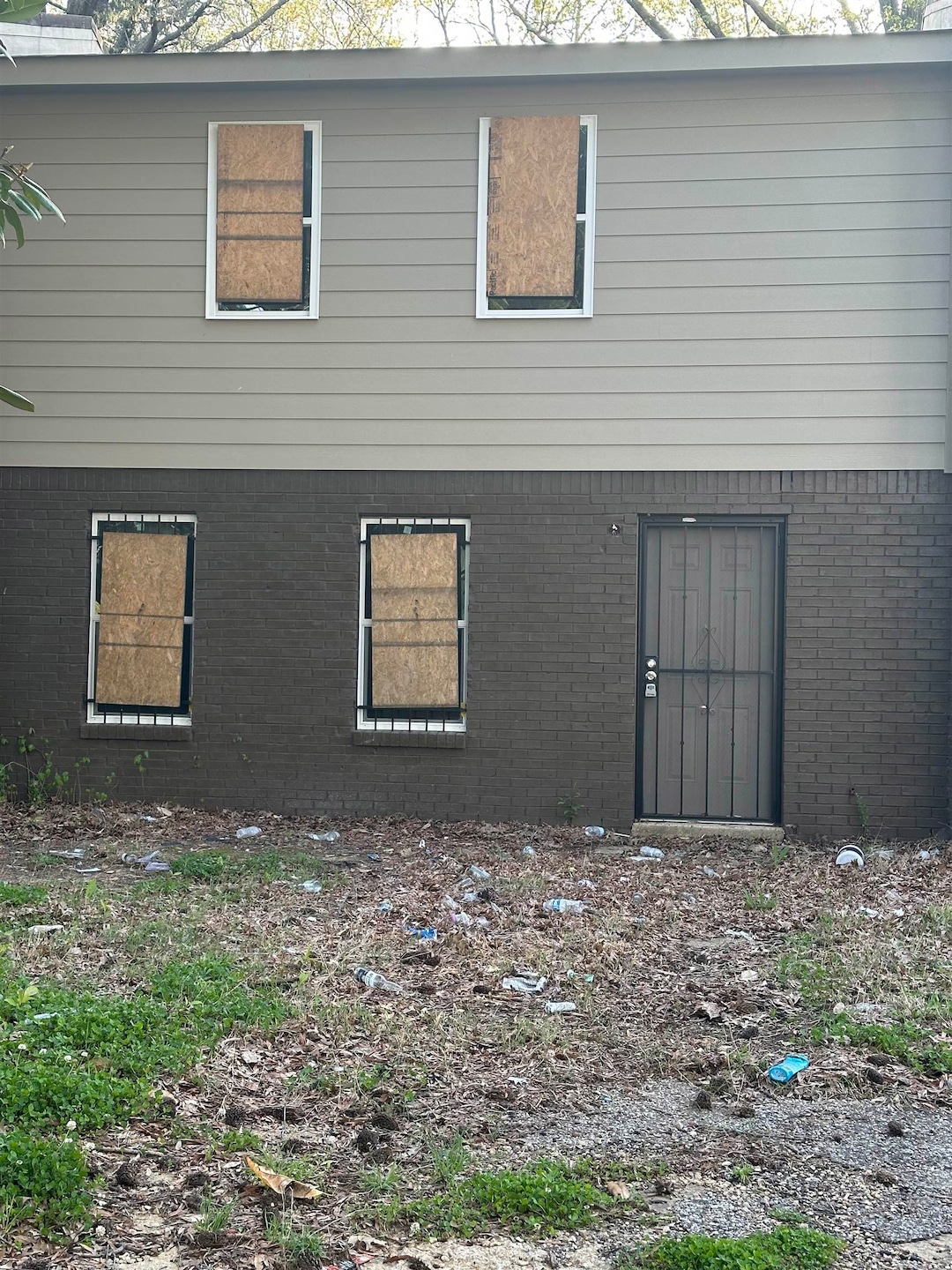Back of property with brick siding