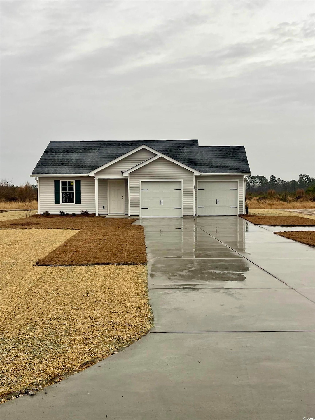 View of front facade featuring a garage
