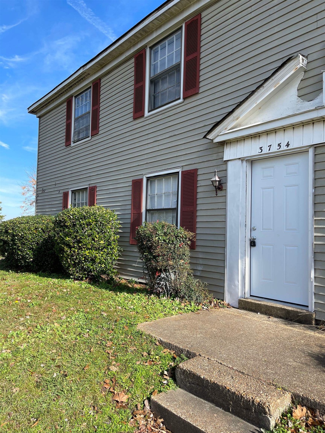 View of front of property with a front yard