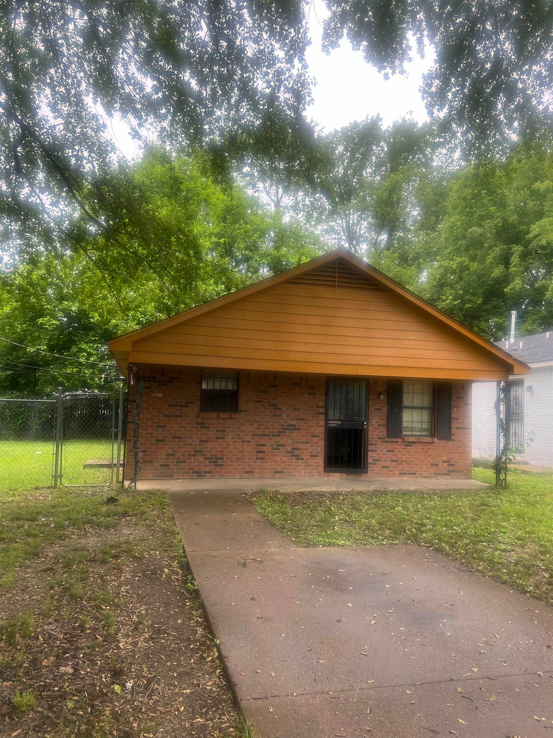 View of home's exterior with a yard